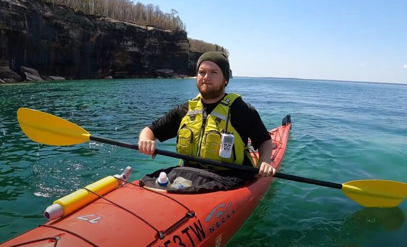 Guy kayaking solo at Pictured Lake